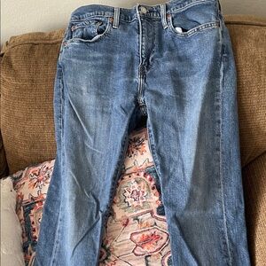 Levi's light blue denim jeans with tan leather patch